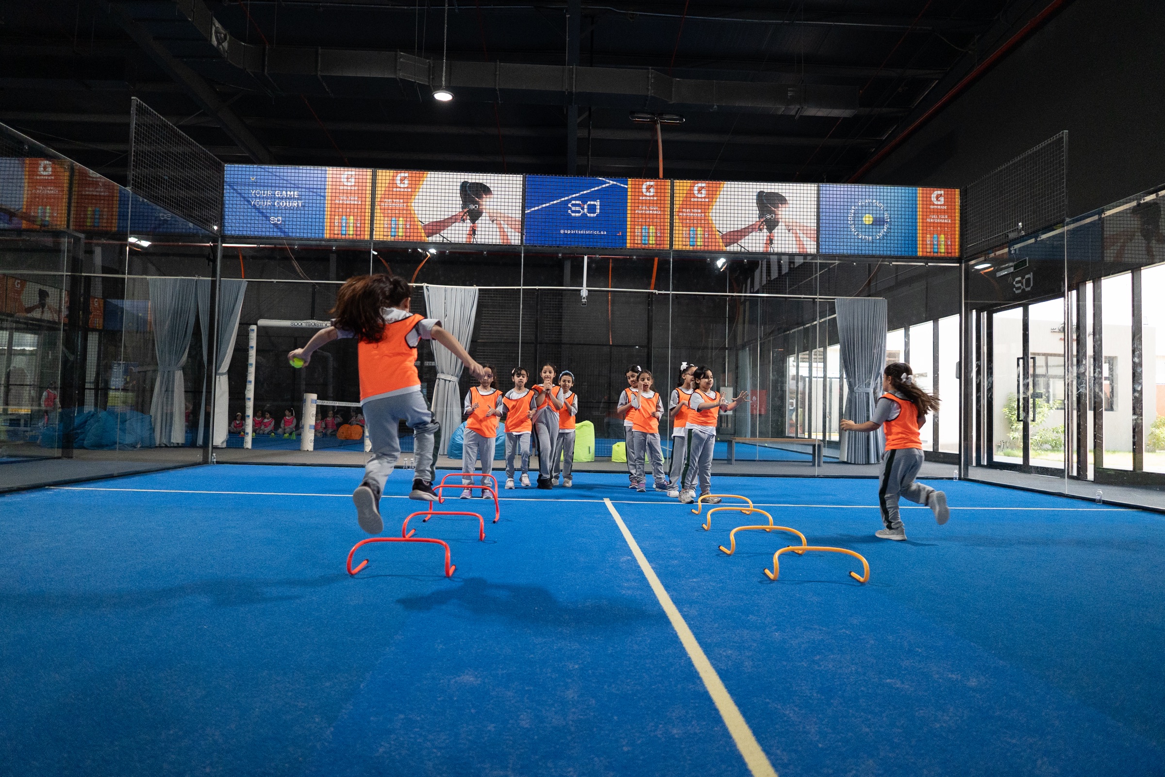Students running court activities during a Sports District school trip